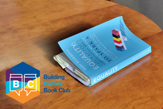 blue book sitting on a table on right and logo in bottom, left corner with words "Building Culture Book Club"